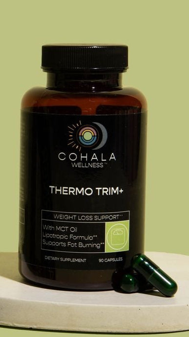 COHALA Wellness Thermo Trim+ supplement bottle with two green capsules on a pale green background