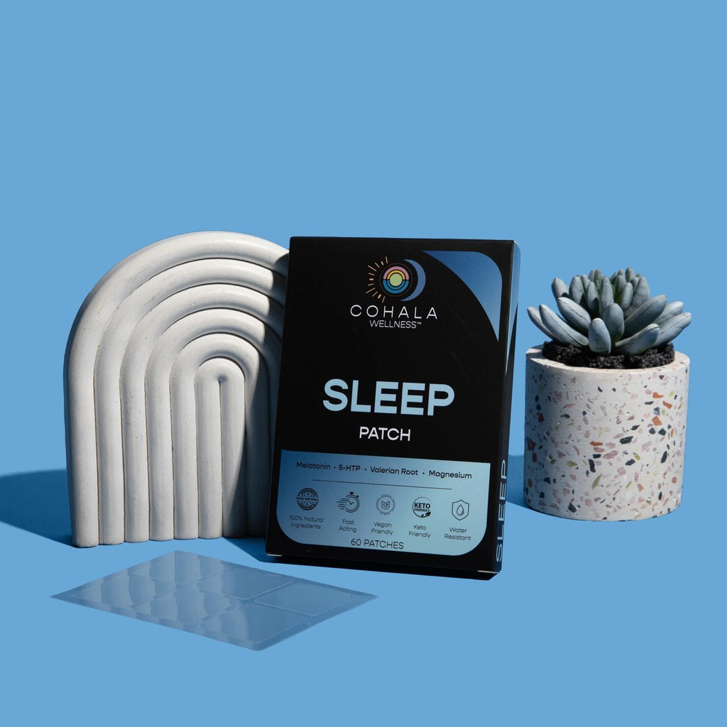 COHALA Wellness Sleep Patch box between a white arch and a potted succulent on a blue background